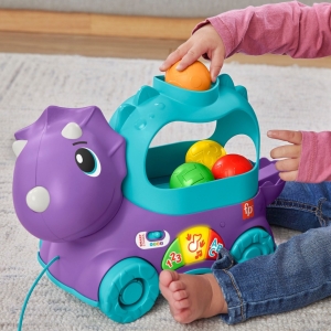 Fisher price hrající dino s vyskakujícími míčky